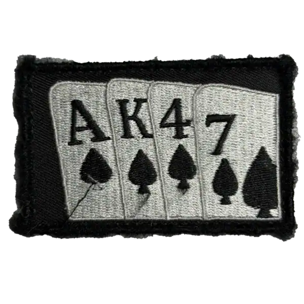 AK47 Russian trophy patch with playing card symbols embroidered on black textile background