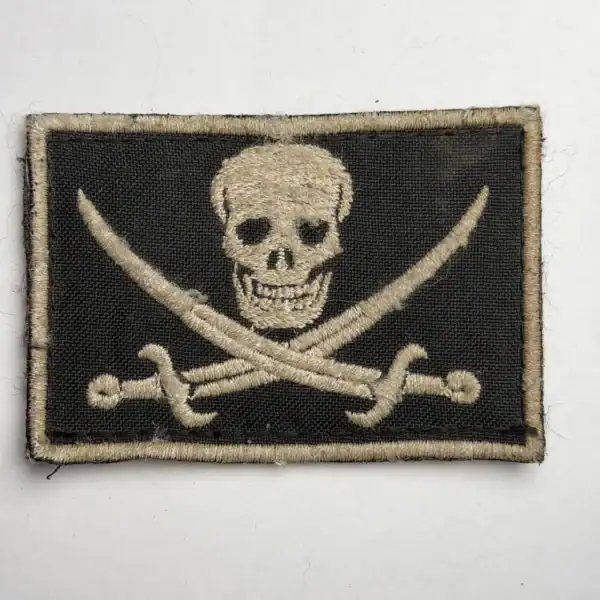 Russian Pirate Head Trophy Patch embroidered with skull and crossed sabers on black field fabric