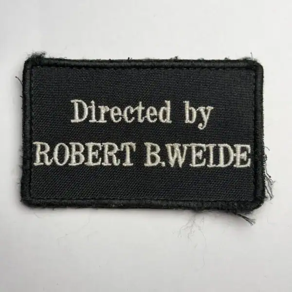 Directed by Robert B. Weide Trophy Patch embroidered with English meme text on black fabric