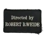 Directed by Robert B. Weide Trophy Patch 7 Directed by Robert B. Weide Trophy Patch embroidered with English meme text on black fabric