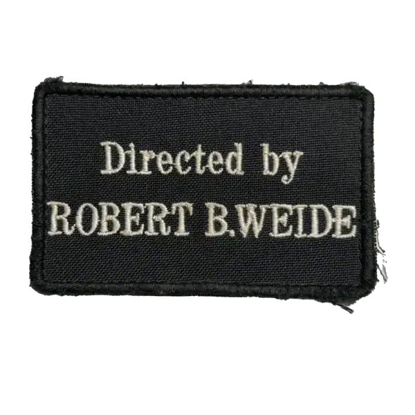 Directed by Robert B. Weide Trophy Patch embroidered with English meme text on black fabric