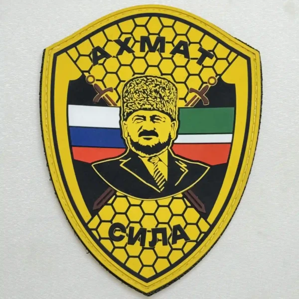 Akhmat Sila PVC Patch with Russian and Chechen flags, crossed swords and a central portrait design associated with the Russia–Ukraine conflict.