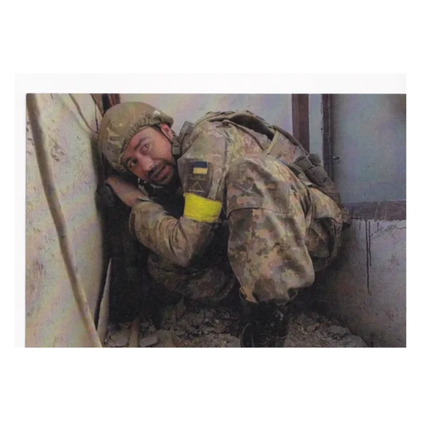 Russian FPV Drone Threat Leaflet with red counting-rhyme text and a Ukrainian serviceman wearing a yellow armband inside a damaged position.