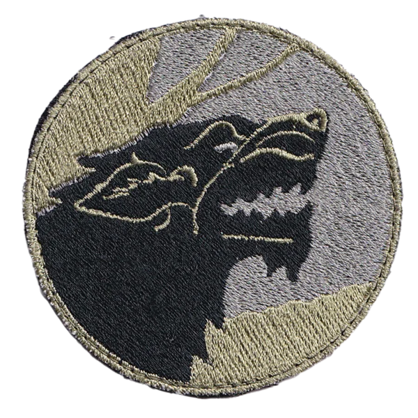 Russian wolf patch with embroidered black wolf profiles, gray field background and tan border in a modern military-style design.