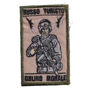 Home 18 Russian Outlaw Squad Patch with an armed operator, rifle, rocket silhouettes, black lettering, olive border, and trophy provenance from the Russia–Ukraine conflict.