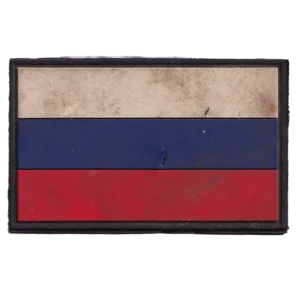 Home 20 Russian Shrapnel Damaged Flag Patch in white, blue, and red PVC with visible impact puncture, field wear, black border, and hook-and-loop backing.