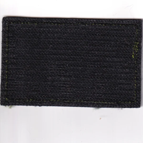 Russian Sister Told Me Patch with white Cyrillic text embroidered on olive fabric, green border, and hook-and-loop backing.