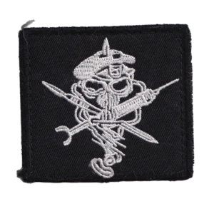 Home 15 Russian Hippocrates Medic Patch with embroidered skull, crossed surgical tools, black fabric, hook backing, and visible combat-used condition.