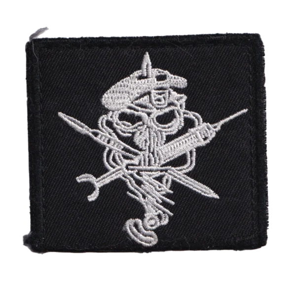 Russian Hippocrates Medic Patch with embroidered skull, crossed surgical tools, black fabric, hook backing, and visible combat-used condition.