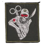 Russian Combat Medic Patch | Ukraine Trophy 5 Russian combat medic patch with embroidered skeletal field medic, trauma shears, red cross details and olive background, associated with the Russia-Ukraine conflict.